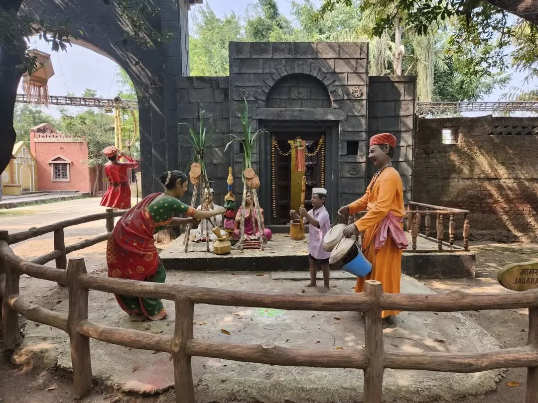 Sai Baba temple gate toran mangalcharan puja ceremony statue at Sai Heritage Village near Naini Lake Nainital, with banana plants, kalash, boy drummer, saffron-robed priest, bride, groom in red turban, perfect cultural heritage experience Uttarakhand tour