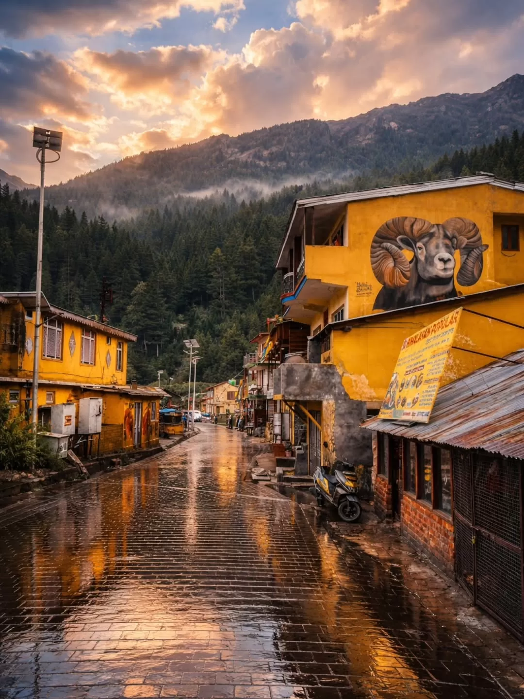Scenic mountain town on Char Dham route in Uttarakhand with misty hills and vibrant streets featured in Uttarakhand tour packages