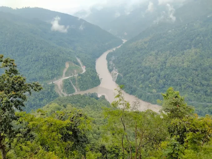 7th Mile View Point in Kalimpong, West Bengal, overlooking the Teesta River winding through lush green hills, a popular scenic halt featured in West Bengal tour packages.