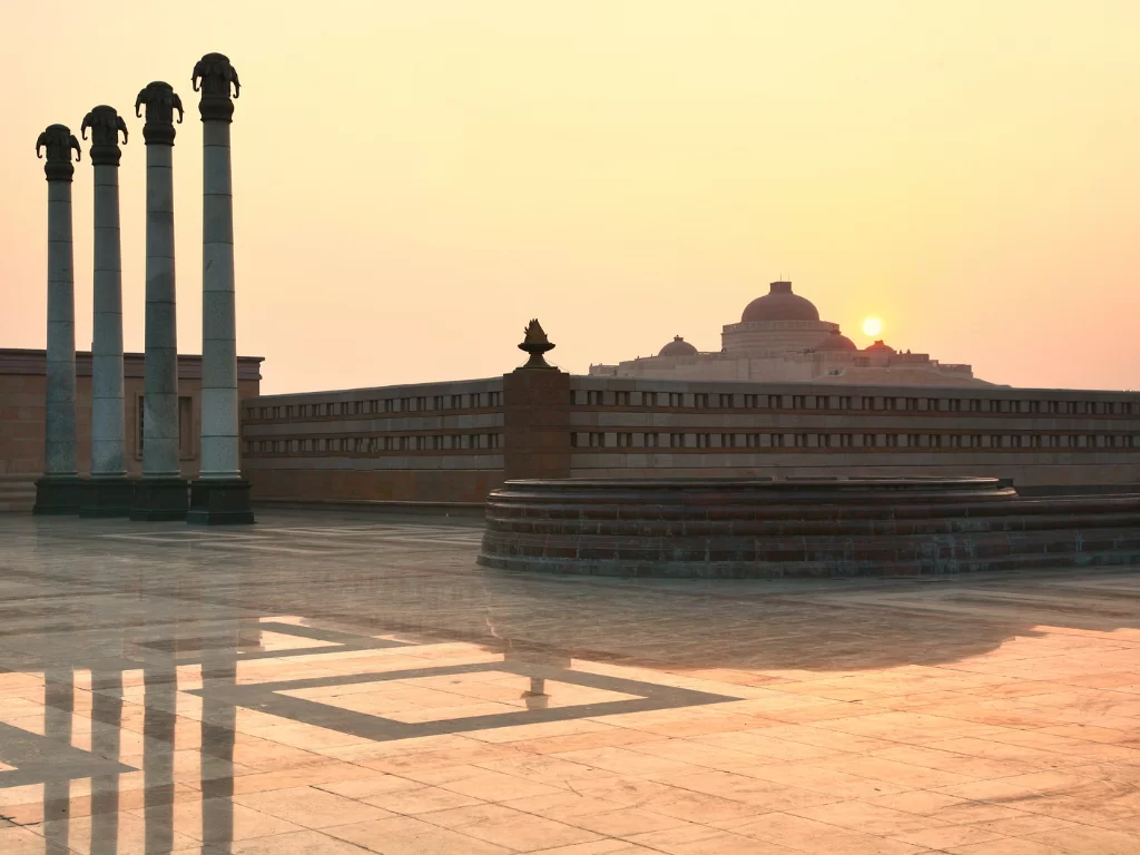 Ambedkar Memorial Park at Lucknow during sunset, featuring pillars amphitheater dome reflections, perfect cultural Uttar Pradesh tour package.