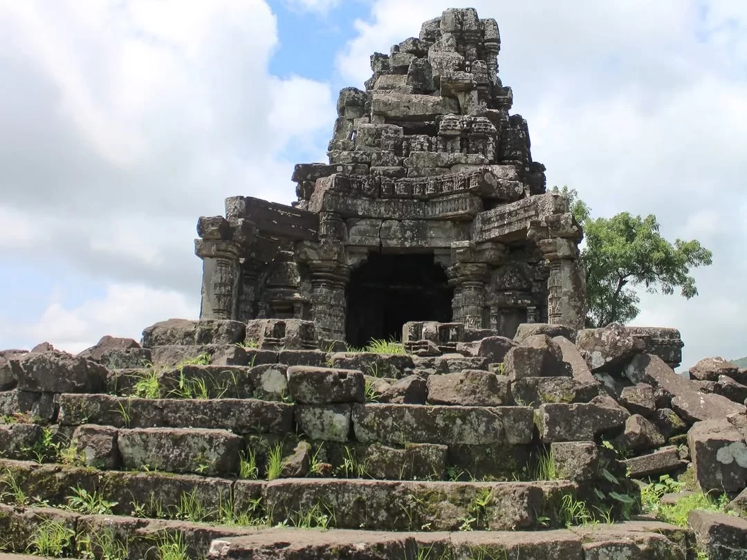 Ancient stone temple ruins at Anjaneri Nashik Maharashtra with stepped pathway and weathered carvings under open sky