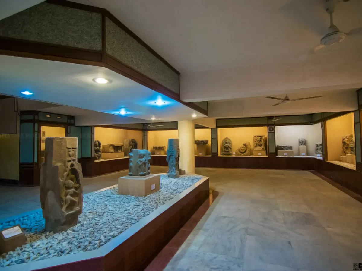 Ancient stone sculptures at Assam State Museum Guwahati during daytime, featuring artifacts displays lighting, perfect cultural experience Assam tour package. 