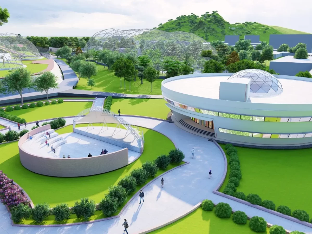 Modern geodesic domes at Assam State Zoo cum Botanical Garden Guwahati during sunny day, featuring green lawns walkways buildings hills, perfect family experience Assam tour package.