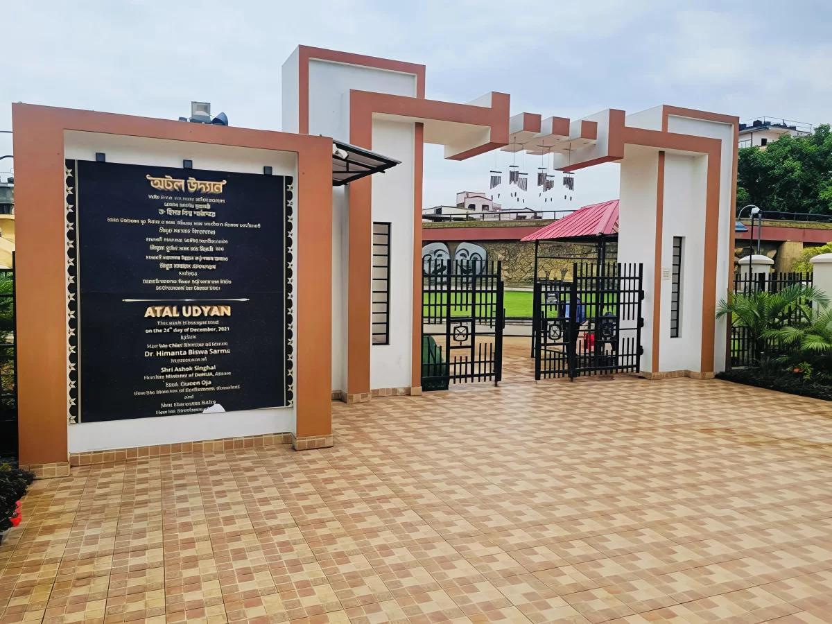 Atal Udyan Adabari Park Guwahati entrance during cloudy day, featuring welcome gate landscaping, perfect family picnic experience Assam tour package.