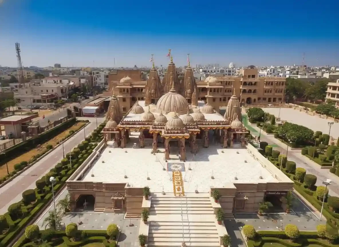 BAPS Shri Swaminarayan Akshardham Mandir aerial view of the intricate stone carvings and domes in Jaipur, Rajasthan.