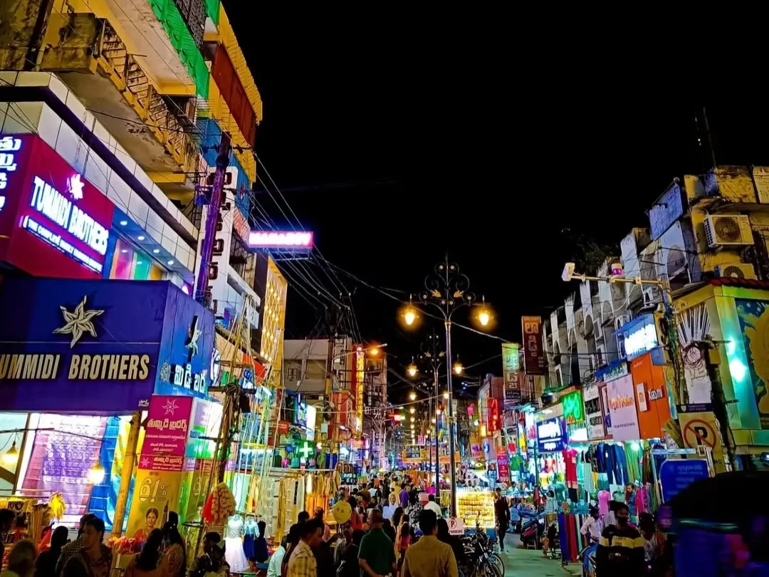 Besant Road Vijayawada bustling shopping street with vibrant night market in Andhra Pradesh tour packages.