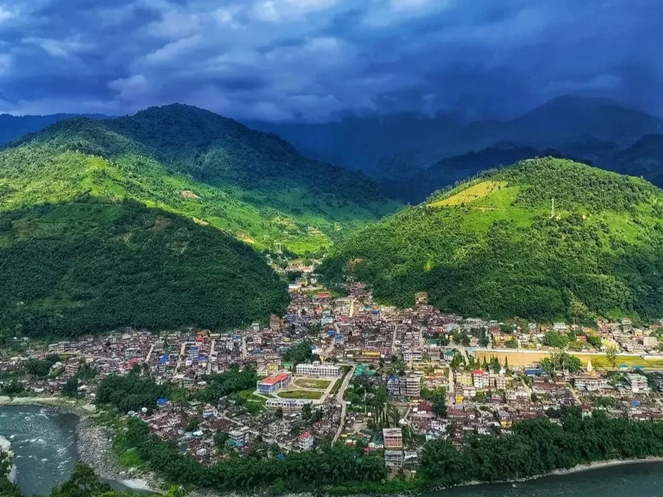 Bhalukpong Town scenic riverside destination surrounded by lush green hills and dramatic mountain landscapes in Arunachal Pradesh Package.