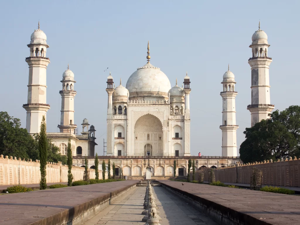 Bibi Ka Maqbara mausoleum Aurangabad during clear day, featuring white domes minarets gardens reflecting pool, perfect Maharashtra heritage tour package.