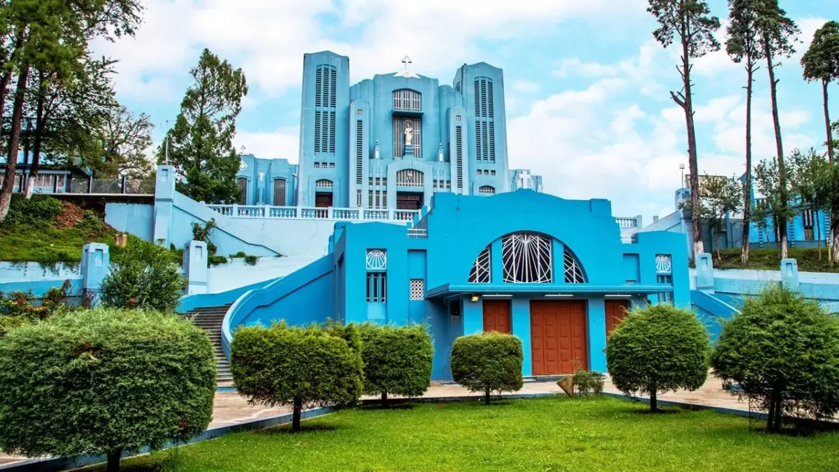 Cathedral of Mary Help of Christians in Shillong, striking blue church with grand facade and landscaped gardens.
