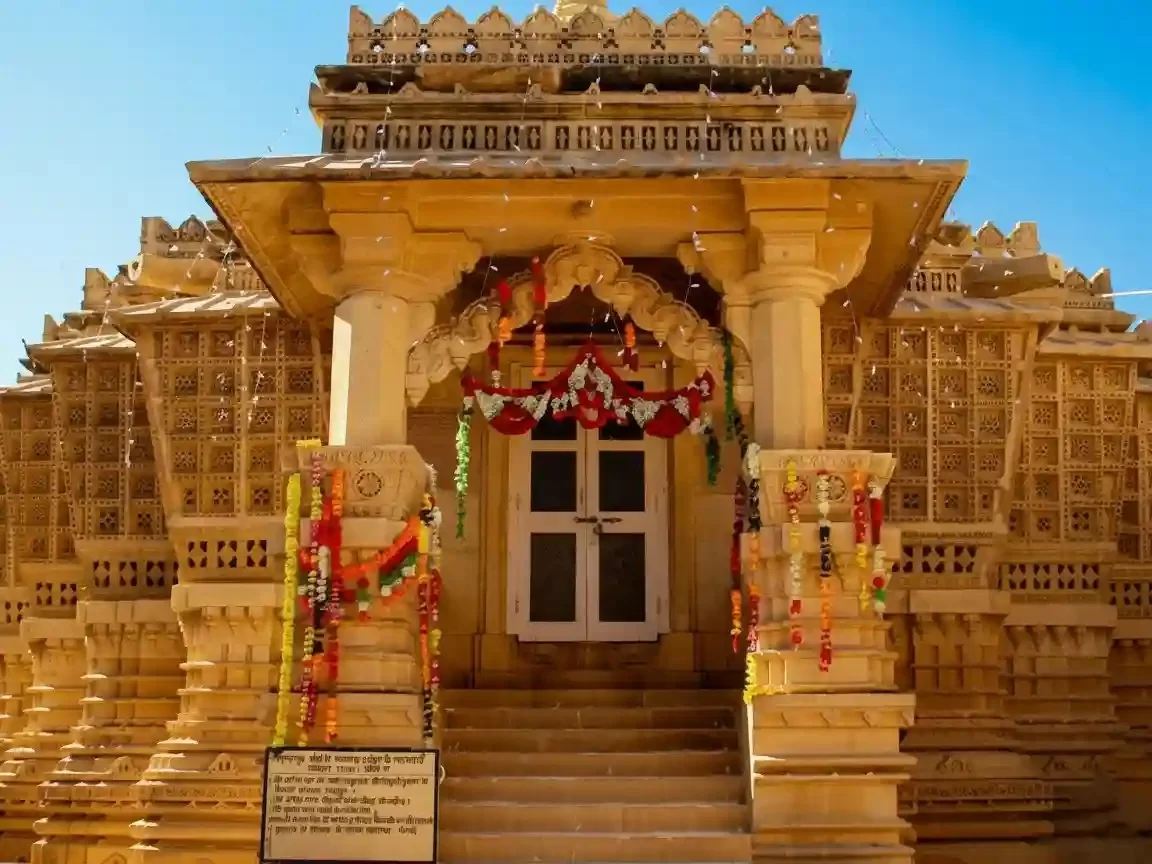 Chandraprabhu Jain Temple yellow sandstone architecture with intricate carvings at the historic Jaisalmer Fort site.