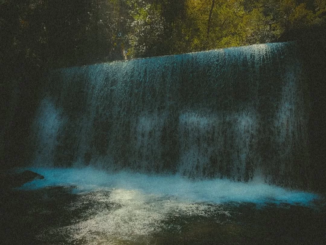 Choskorong Waterfall serene cascading waterfall surrounded by dense forest and natural beauty in Arunachal Pradesh Package.