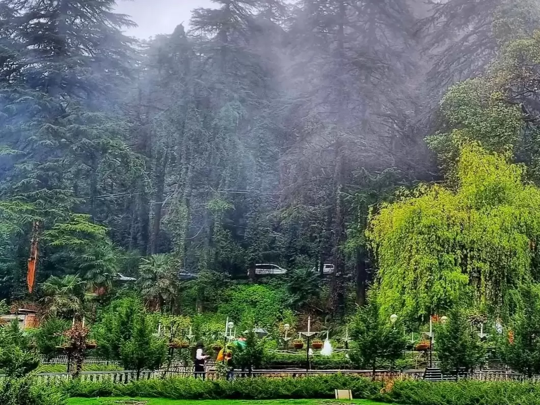 Company Garden Mussoorie scenic botanical park with lush lawns, deodar trees and misty Himalayan surroundings