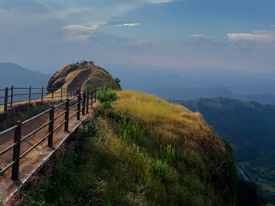 Scenic trail leading to Connaught Peak in Mahabaleshwar, Maharashtra, offering panoramic views of rolling hills and valleys, a popular viewpoint included in Maharashtra tour packages.