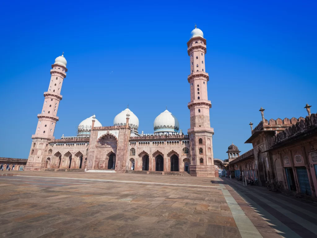 Taj-ul-Masajid at Bhopal during clear daylight, featuring pink minarets white domes courtyard, perfect cultural Madhya Pradesh tour package.