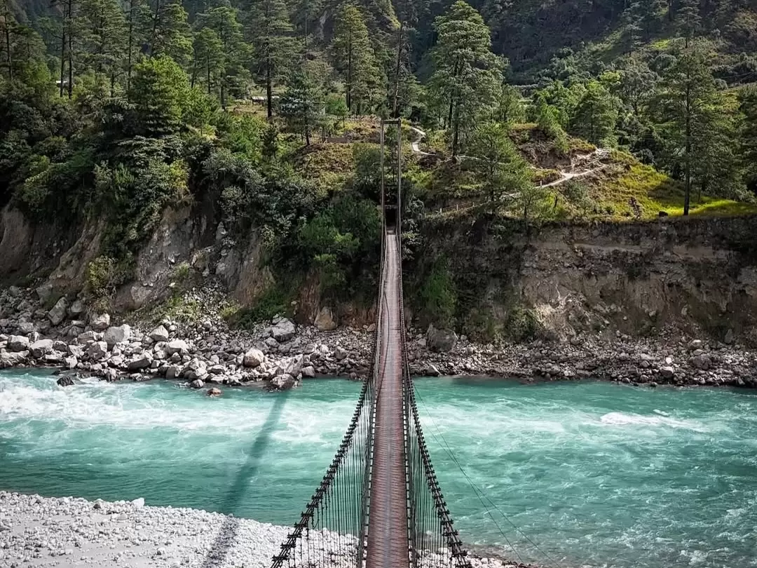 Dong Village scenic riverside hamlet with suspension bridge and lush mountain surroundings in Arunachal Pradesh Package.