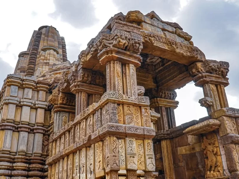 Dulhadev Shiva Temple in Khajuraho, Madhya Pradesh, showcasing intricate sandstone carvings and ornate pillars, a historic attraction often included in Madhya Pradesh tour packages.