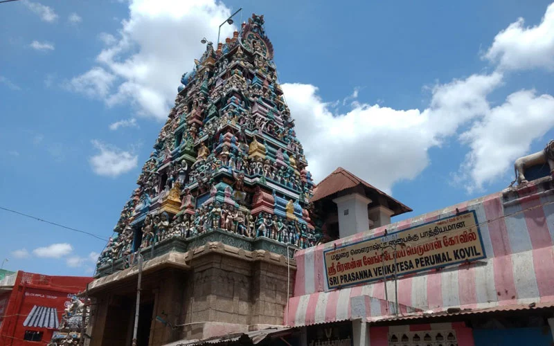 Shri Murugan Temple during daylight, featuring colorful gopuram and intricate carvings, perfect spiritual experience, Tamil Nadu tour packages.