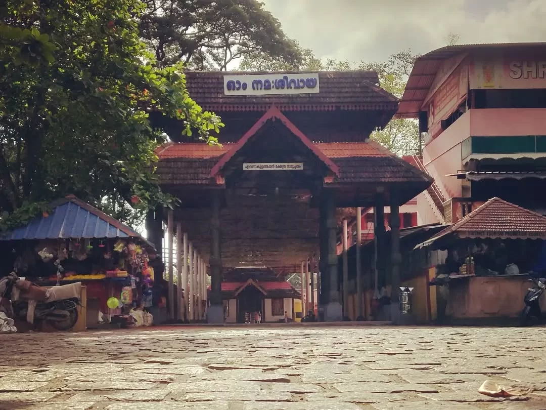 Ernakulam Shiva Temple, Kerala traditional temple entrance with tiled roof and stone pathway