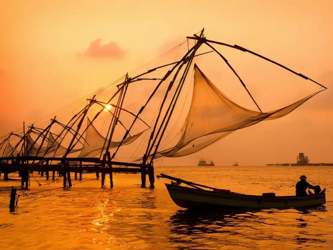 Fort Kochi in Kerala, iconic Chinese fishing nets and sunset view over Arabian Sea coastline.