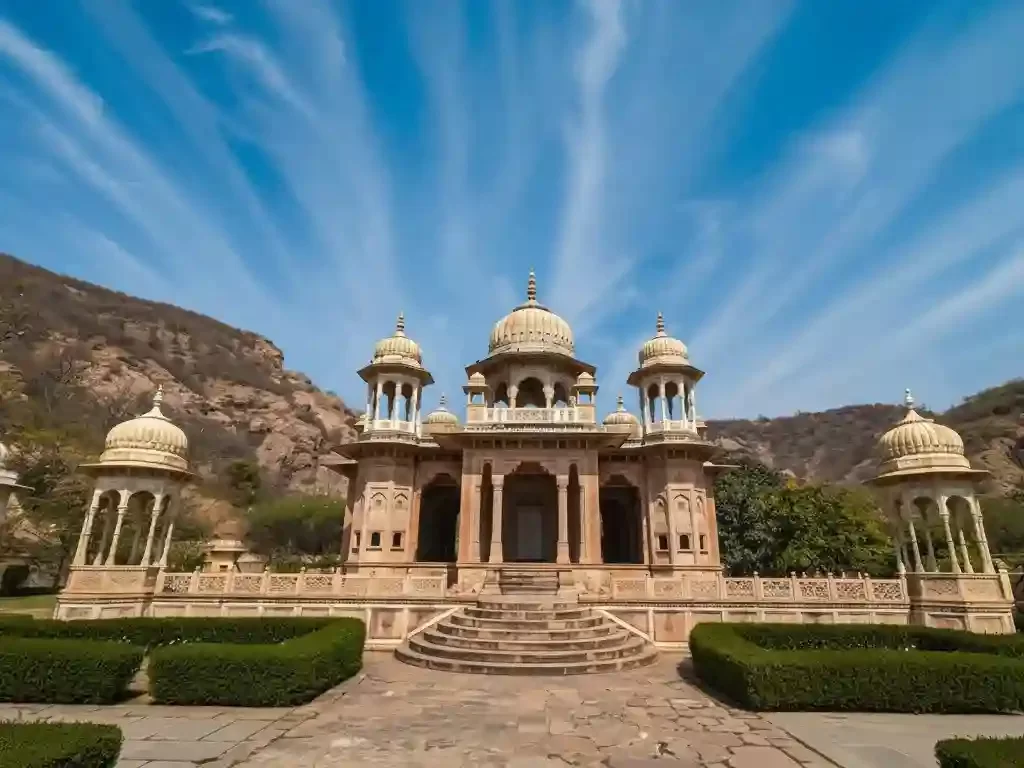 Gaitor Ki Chhatriyan intricate marble and sandstone cenotaphs with carved domes and pillars at the royal crematorium in Jaipur Rajasthan.