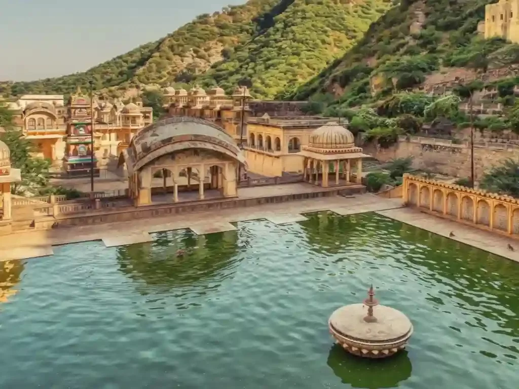 Galtaji Temple ancient Hindu pilgrimage site featuring natural freshwater springs and sacred kunds nestled between mountain peaks near Jaipur Rajasthan.