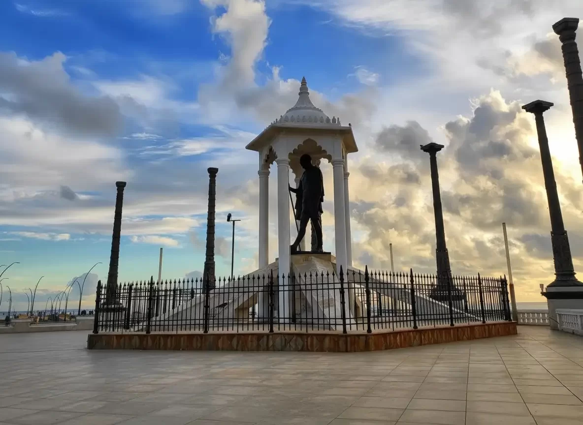 Gandhi Memorial Museum in Madurai featuring the historic white palace architecture, green lawns, and arched entrances.