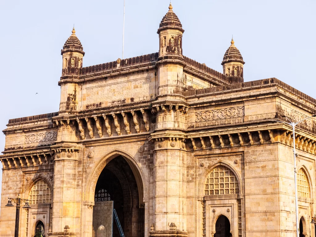 Gateway of India close-up showcasing intricate Indo-Saracenic stone arches and domed turrets, highlighting Mumbai’s iconic waterfront monument and must-visit heritage sightseeing spot in Maharashtra.