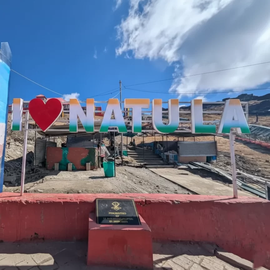 I Love Nathu La sign near Gangtok at the high altitude mountain pass, a popular photo spot included in Sikkim tour packages.