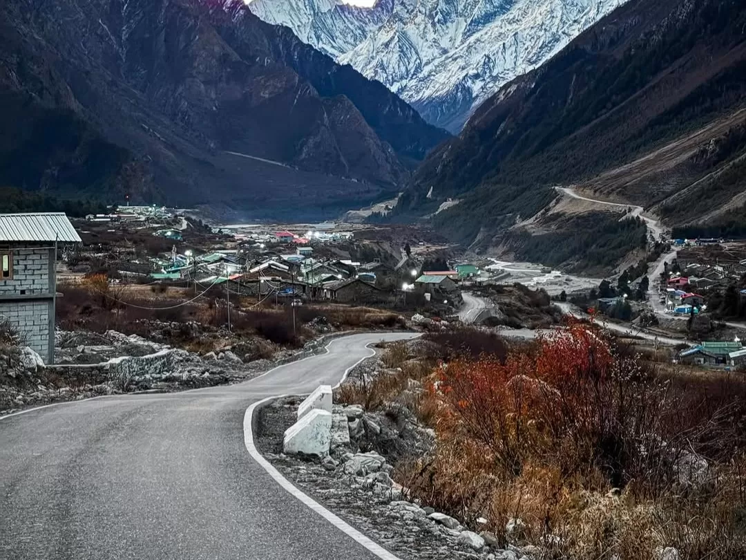 Gunji Himalayan village with winding mountain road and scenic valley landscape in Uttarakhand tour packages.