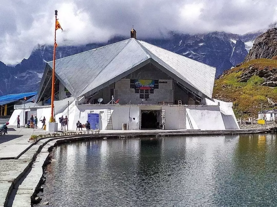Gurdwara Hemkund Sahib in Ghangharia, Uttarakhand set beside the glacial lake with snow-clad Himalayan peaks in the backdrop, a revered Sikh pilgrimage site included in Uttarakhand tour packages