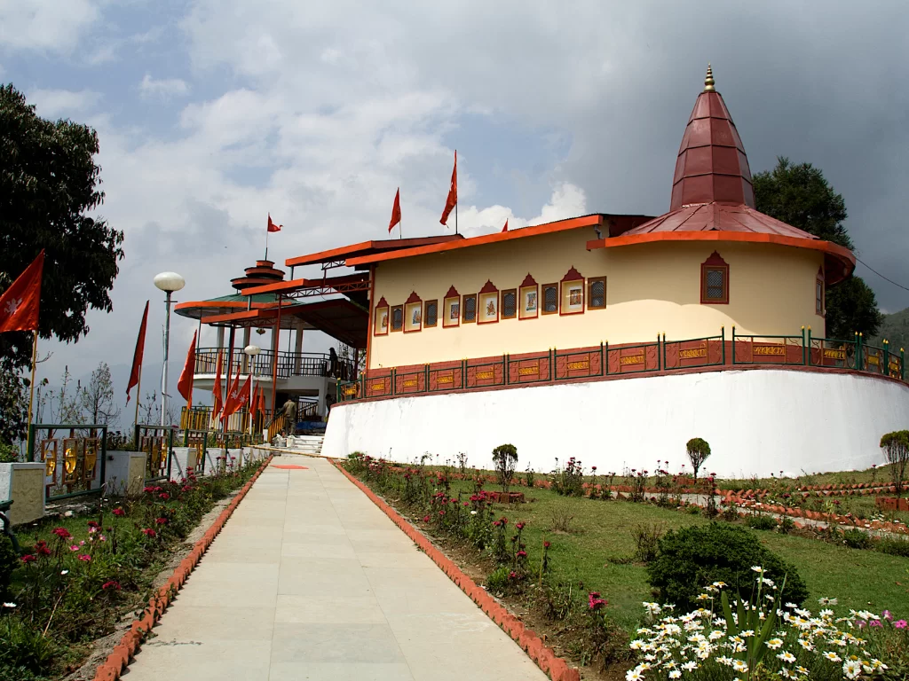 Hanuman Tok temple Gangtok Sikkim during cloudy skies, featuring hilltop shrine garden pathway, perfect spiritual viewpoint experience Sikkim tour package.