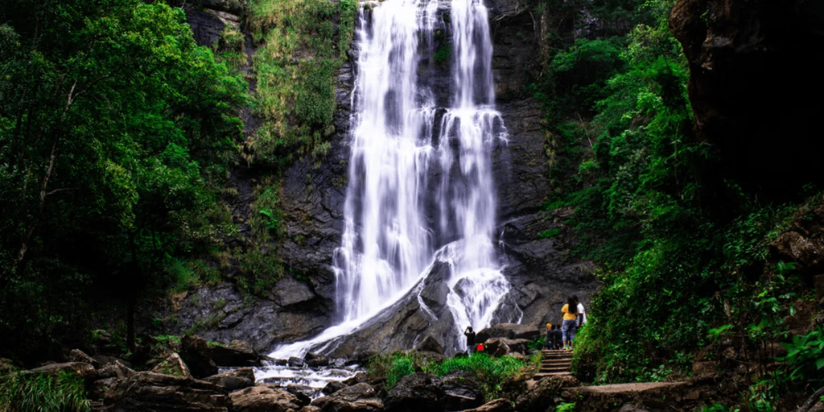 Hebbe Waterfalls in Chikkamagaluru during daylight, featuring cascading waterfall and lush forest, perfect nature experience, Karnataka tour packages.