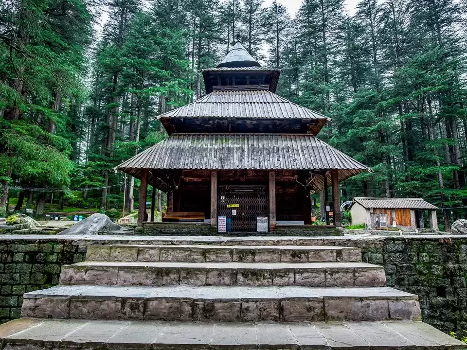 Hidimba Temple at Manali Himali Pradesh during misty weather, featuring multi-tiered wooden pagoda deodar forest, ancient sanctuary Incredible India experience Himachal Pradesh tour package.