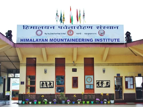 Himalayan Mountaineering Institute in Darjeeling, West Bengal, featuring its iconic entrance building with mountaineering displays and national flags, a renowned adventure training center included in West Bengal tour packages.