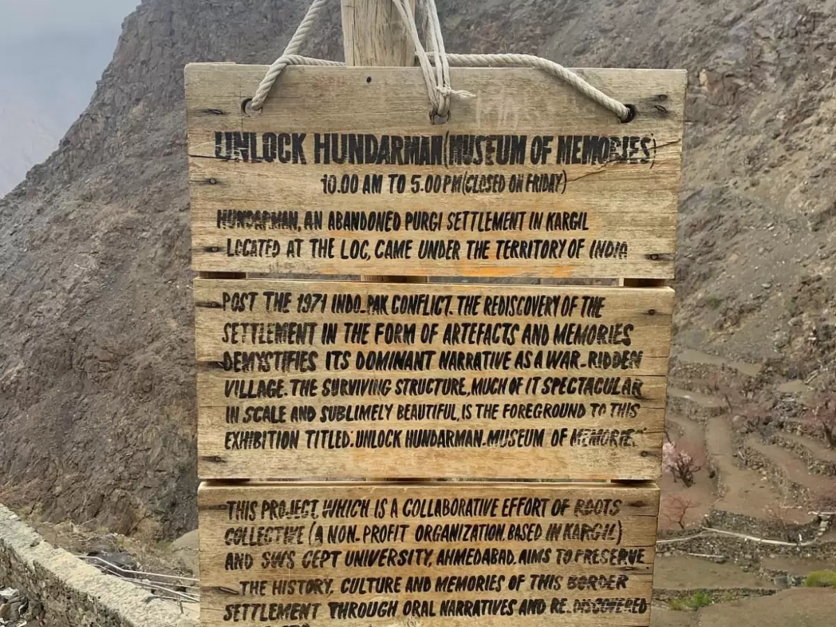 Hunderman Village Kargil Ladakh Unlock Hunderman Museum of Memories signboard at LoC border ghost village, 1971 war artifacts exhibition 10am-5pm closed Fridays, ROOTS collaboration project preserving Brokpa history, perfect adventure India tour package.