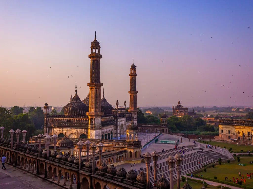 Bara Imambara at Lucknow during sunset, featuring minarets domes gardens birds, perfect cultural Uttar Pradesh tour package.