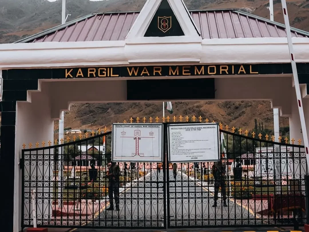 Kargil War Memorial Drass Ladakh entrance gate army soldiers, pink walls Himalayan peaks Srinagar Leh highway, perfect Ladakh Operation Vijay tribute package.