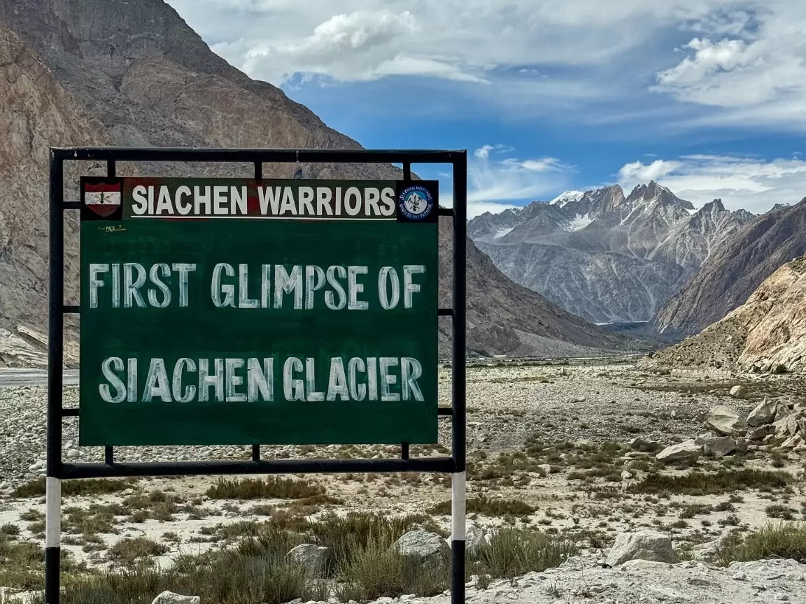 Siachen Warriors signboard first glimpse Siachen Glacier clear view Nubra Ladakh snowcapped Karakoram peaks dramatic valley Indus river military tourism viewpoint Partapur Base Camp.