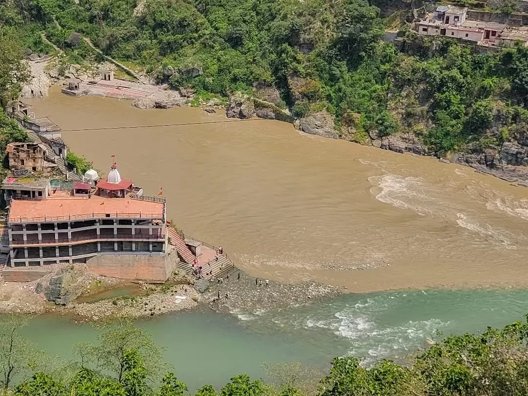 Rudraprayag confluence aerial view Rudranath Temple riverside red dome buildings brown Mandakini turquoise Alaknanda merging forested hills, perfect Char Dham Yatra sacred riverside temple viewpoint, Himachal Pradesh tour packages.