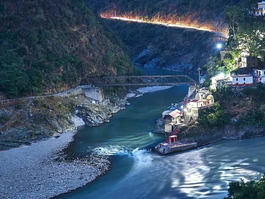 Rudraprayag night view suspension bridge illuminated riverside temples houses road lights Alaknanda River gorge forests, perfect Char Dham Yatra evening scenic riverside panorama, Himachal Pradesh tour packages.