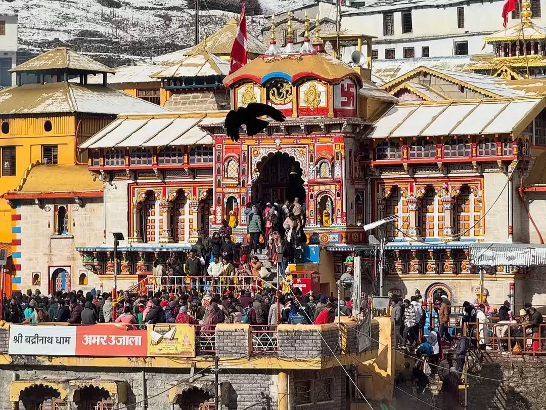 Badrinath Temple Uttarakhand golden roofs red gates snowy mountains pilgrims crowd Char Dham Yatra Uttarakhand tour packages.