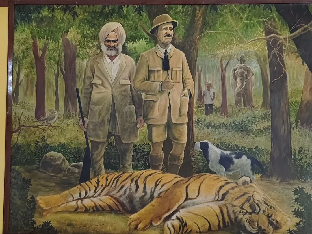 Jim Corbett Museum painting Jim Corbett Jim Davidson tiger hunt, colonial hunters turban hat rifles dead tiger dog forest backdrop, perfect Uttarakhand tour packages.