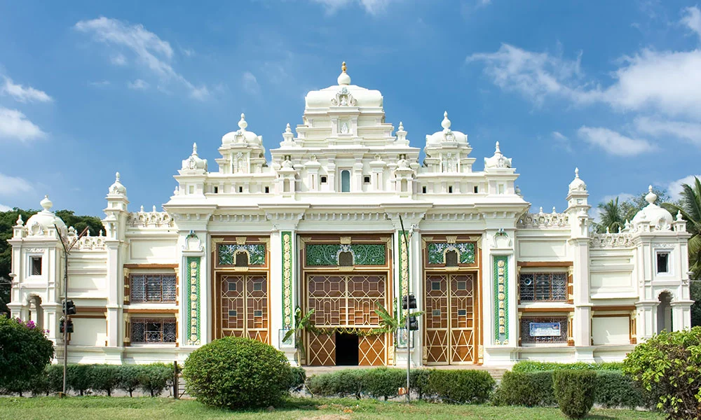Melody World Wax Museum in Mysuru during daylight, featuring grand heritage-style architecture and lush gardens, perfect family experience, Karnataka tour packages.
