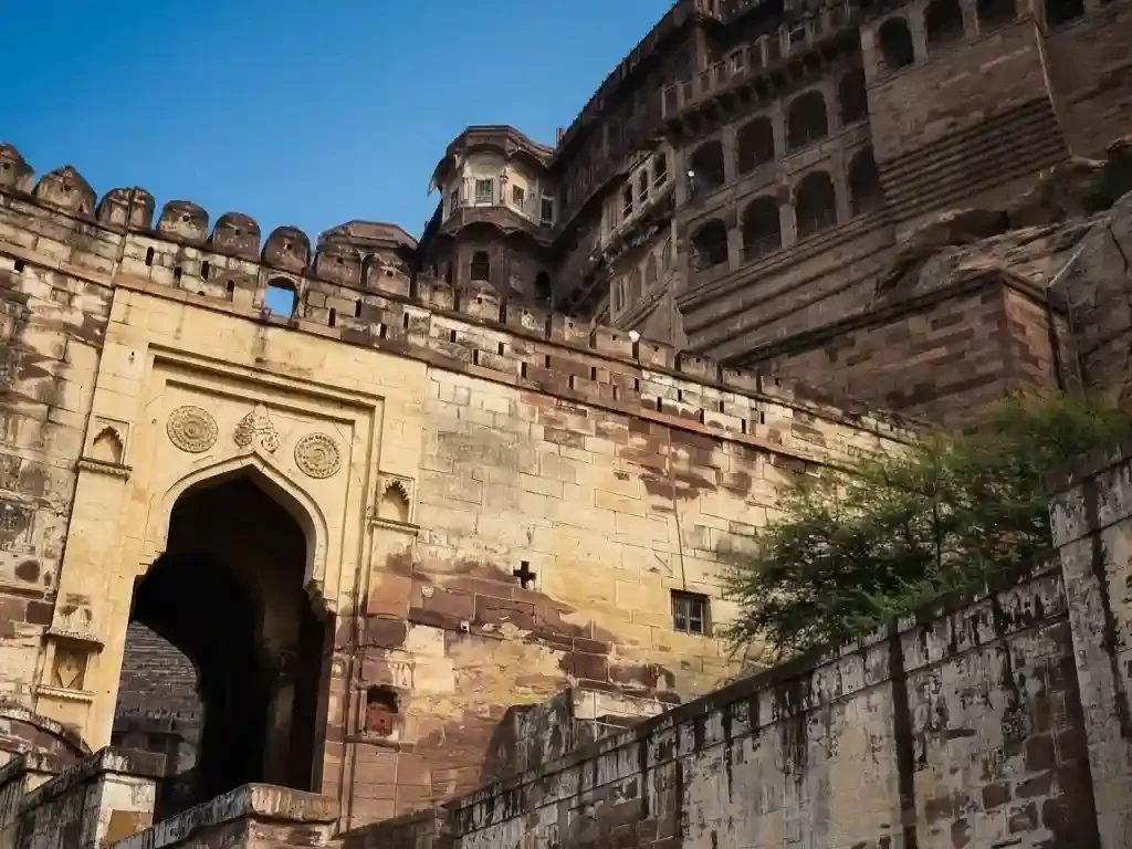 Jai Pol the grand "Victory Gate" and primary entrance to Mehrangarh Fort, featuring historic spiked doors and battle scars in Jodhpur Rajasthan.