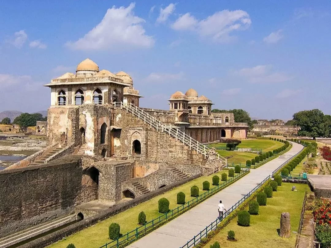 Jal Mahal in Mandu, Madhya Pradesh, featuring historic Afghan-style domed pavilions, stone stairways, and landscaped pathways, a key highlight of Madhya Pradesh tour packages.