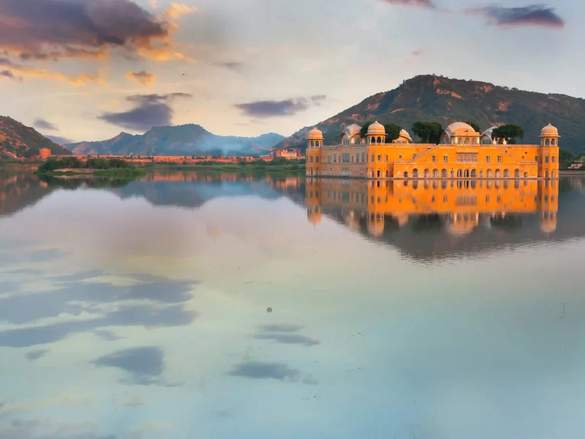 Jal Mahal stunning red sandstone "Water Palace" appearing to float in the middle of Man Sagar Lake against the backdrop of the Nahargarh hills in Jaipur Rajasthan.