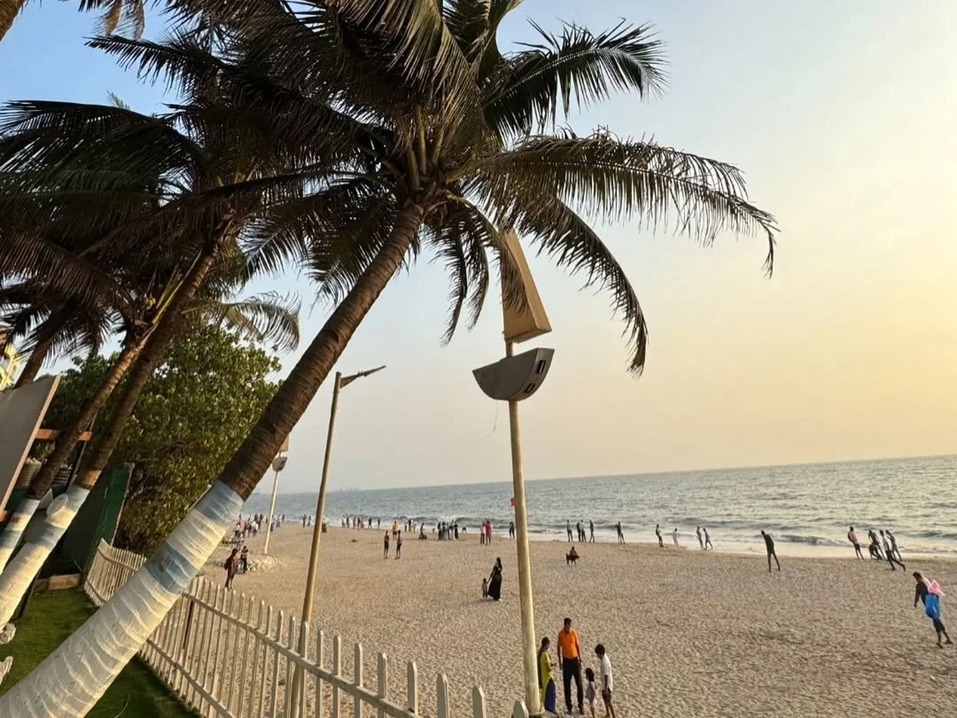 Juhu Beach Mumbai. Popular sandy beach with palm trees, Arabian Sea views and vibrant sunset atmosphere.