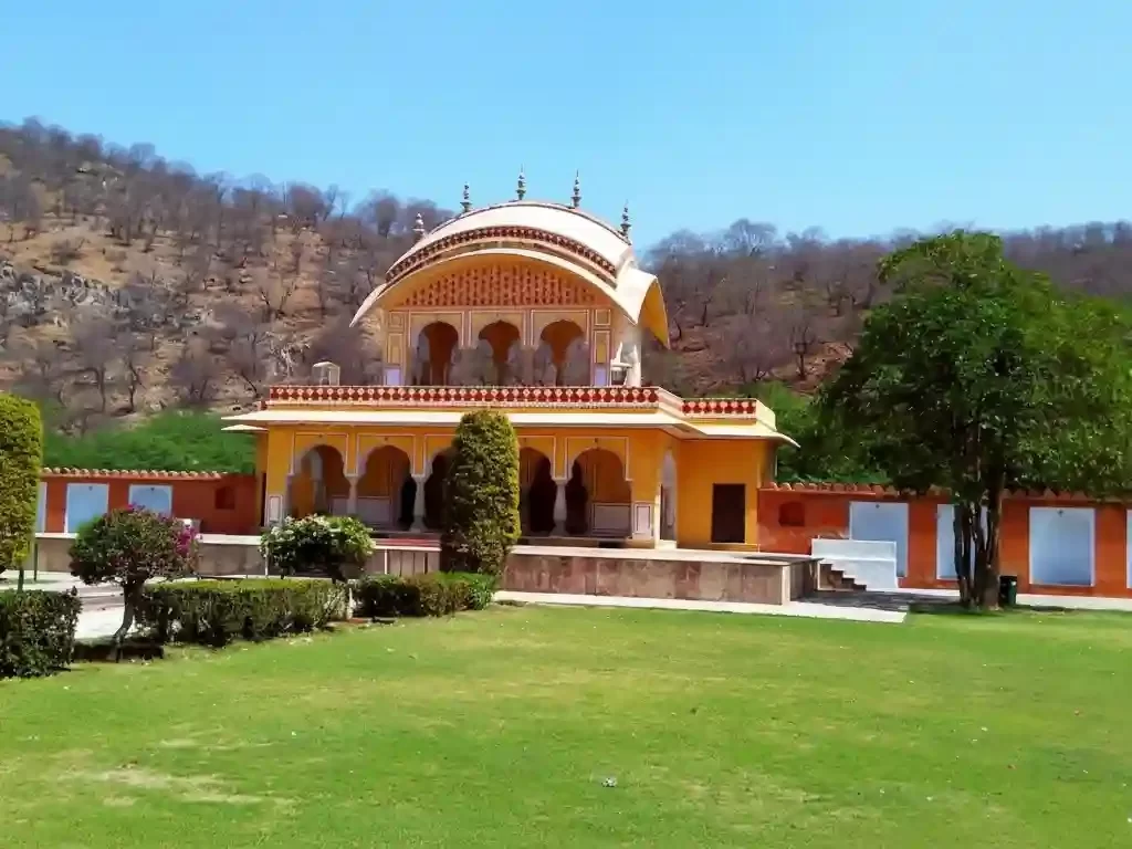 Kanak Vrindavan Park beautifully landscaped garden at the foot of Nahargarh hills, featuring a marble fountain, intricate stone chhatris, and lush green lawns near the Jal Mahal in Jaipur Rajasthan.
