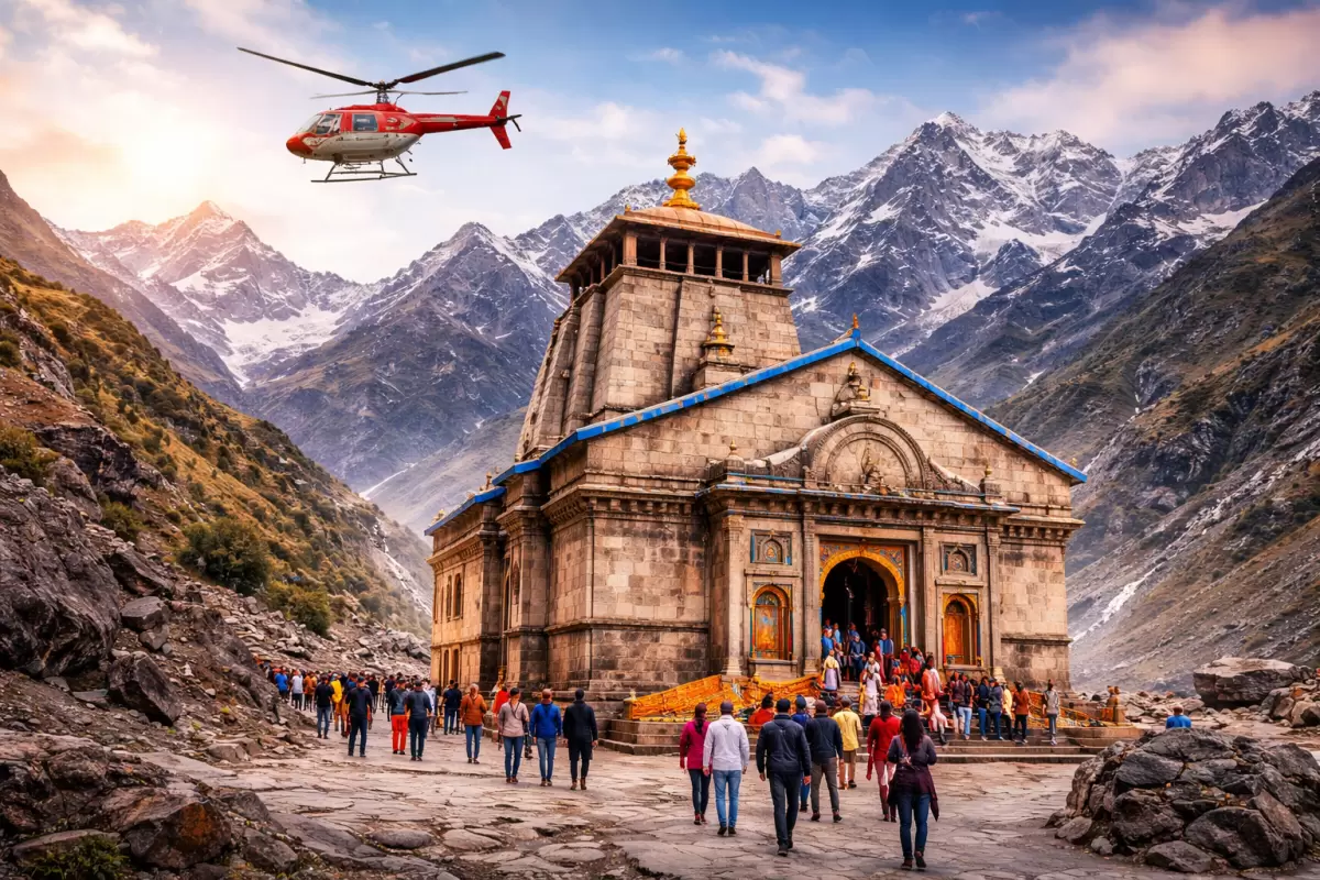 Kedarnath Temple in Uttarakhand with Himalayan peaks, pilgrims, and helicopter services—ideal for spiritual Uttarakhand tour packages.