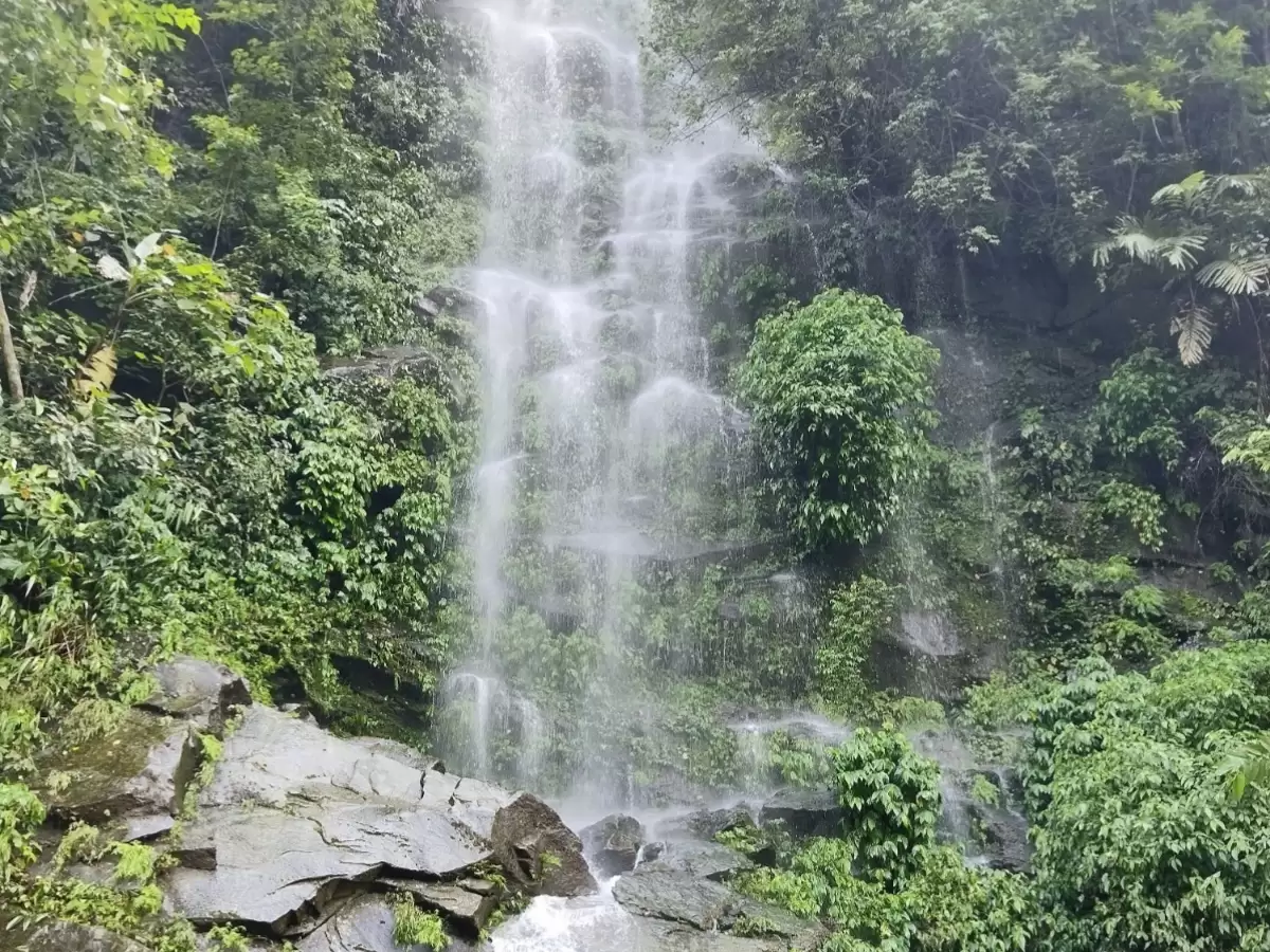 Kevin Waterfall in Arunachal Pradesh cascading through lush green forest and rocky terrain